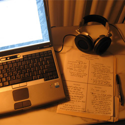 Laptop, papers and headphones